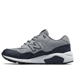 New Balance: Серые кроссовки 