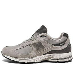 New Balance: Серые кроссовки 