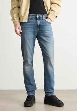 Calvin Klein Jeans: Зауженные джинсы 
