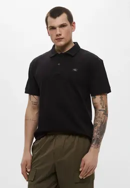 Calvin Klein Jeans: Чёрное поло 