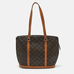 Louis Vuitton: Коричневая сумка 