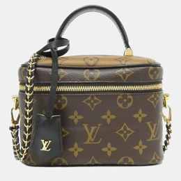 Louis Vuitton: Коричневая сумка 