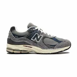 New Balance: Серые кроссовки 