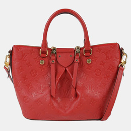 Louis Vuitton: Красная сумка-шоппер 