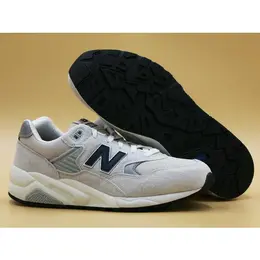 New Balance: Серые кроссовки 