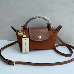 Longchamp: Тёмная сумка 