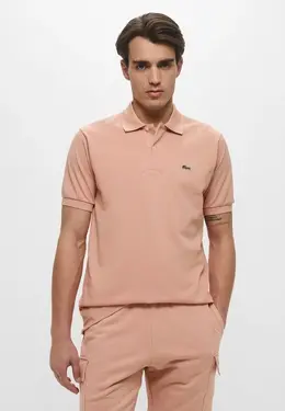 Lacoste: Розовое поло 