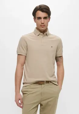 Tommy Hilfiger: Бежевое поло 