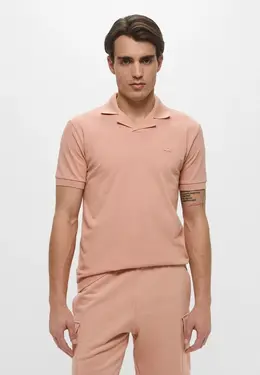 Lacoste: Розовое поло 