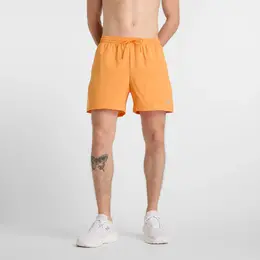 New Balance: Оранжевые шорты 