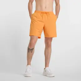 New Balance: Оранжевые шорты 