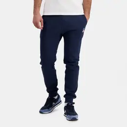Le Coq Sportif: Тёмные брюки 