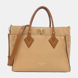 Louis Vuitton: Коричневая сумка 