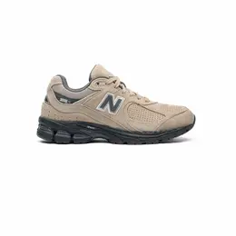 New Balance: Коричневые кроссовки 