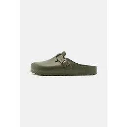 Birkenstock: Зелёные сабо 