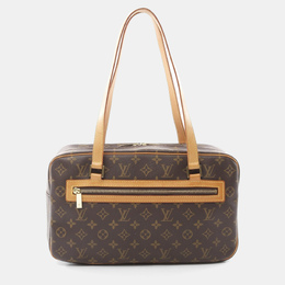 Louis Vuitton: Коричневая сумка 