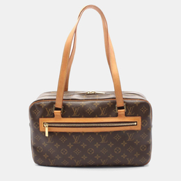 Louis Vuitton: Коричневая сумка 