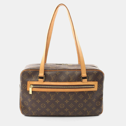 Louis Vuitton: Коричневая сумка 