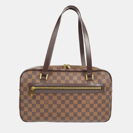 Louis Vuitton: Коричневая сумка 