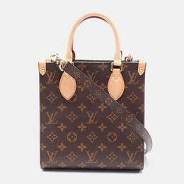 Louis Vuitton: Коричневая сумка 