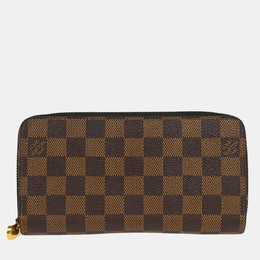 Louis Vuitton: Коричневый кошелёк  Zippy