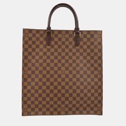 Louis Vuitton: Коричневая сумка 