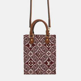 Louis Vuitton: Коричневая сумка-шоппер 