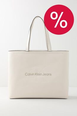 Calvin Klein: Бежевая сумка 