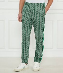 Lacoste: Зелёные брюки 