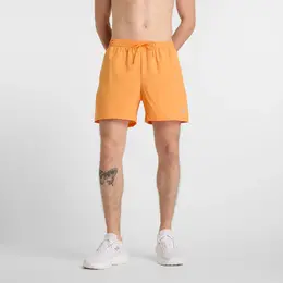 New Balance: Оранжевые шорты 