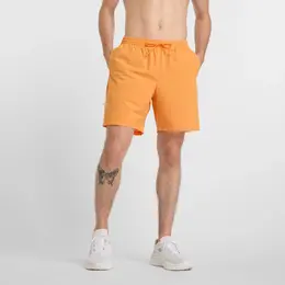 New Balance: Оранжевые шорты 