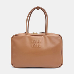 Miu Miu: Коричневая сумка 