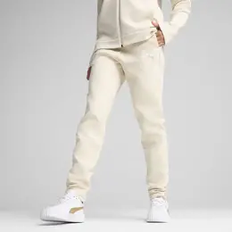 PUMA: Коричневые брюки  Evostripe