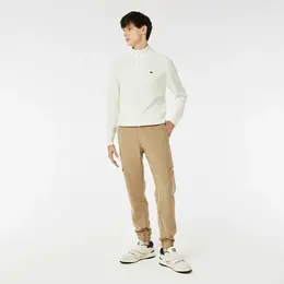LACOSTE: Бежевые брюки 