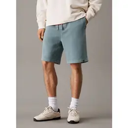 Calvin Klein Jeans: Зелёные шорты 