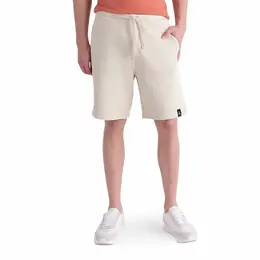 Calvin Klein Jeans: Бежевые шорты 