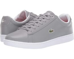 Lacoste: Белые кроссовки 