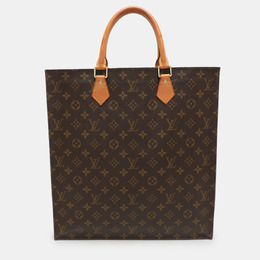 Louis Vuitton: Коричневая сумка 