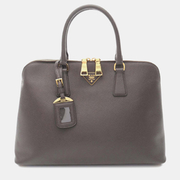 Prada: Коричневая сумка 