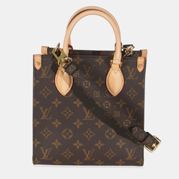 Louis Vuitton: Коричневая сумка 