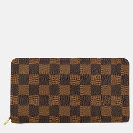 Louis Vuitton: Коричневый кошелёк  Zippy