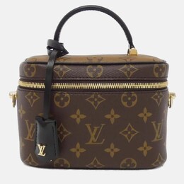 Louis Vuitton: Коричневая сумка 