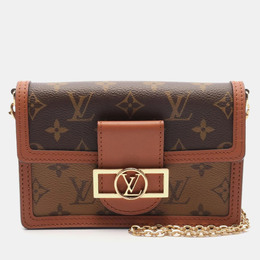 Louis Vuitton: Коричневая сумка 
