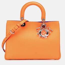 Dior: Оранжевая сумка 
