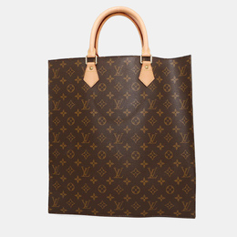 Louis Vuitton: Коричневая сумка 