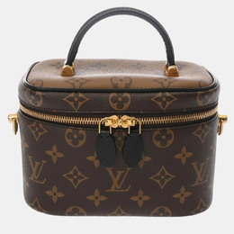 Louis Vuitton: Коричневая сумка 