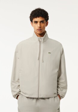 Lacoste: Серая куртка 