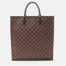 Louis Vuitton: Коричневая сумка-шоппер 