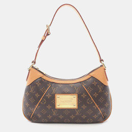 Louis Vuitton: Коричневая сумка 