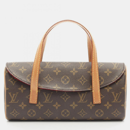 Louis Vuitton: Коричневая сумка 